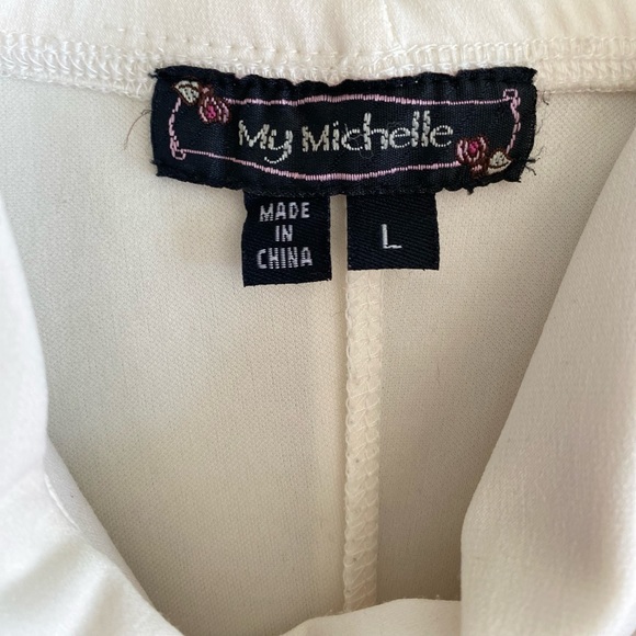 Ivory and black Cocktail dress with lace trim along bottom. - Picture 4 of 5